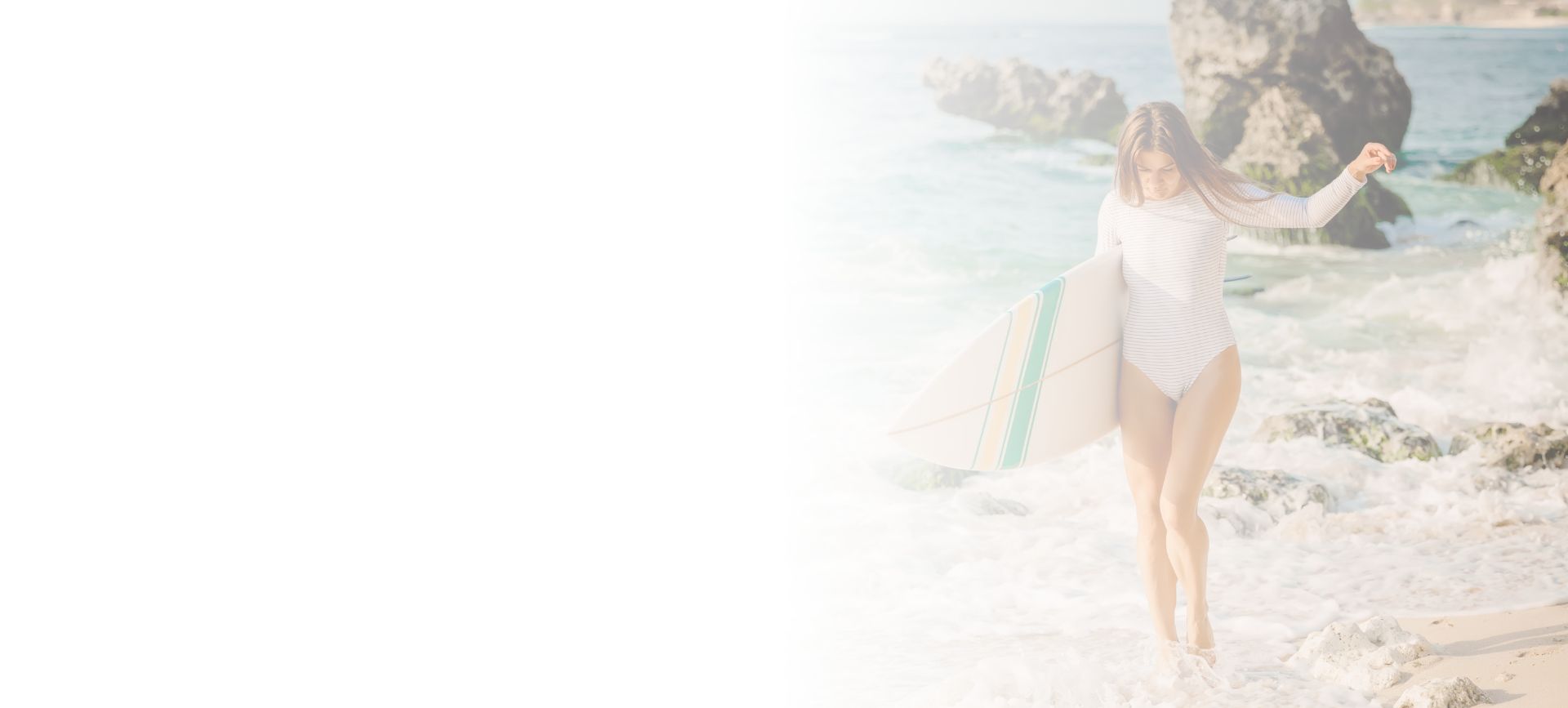 Woman with surfboard on the beach